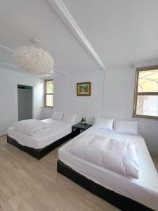 南苑莊園 NanYuan Resort Manor客房内的一张或多张床位