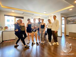 a group of people standing in a room at Kim Ngan Phat Deluxe Apartment in Danang