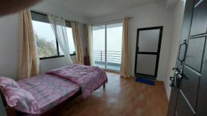 Postel nebo postele na pokoji v ubytování Dumfu Homestay
