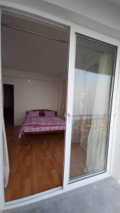 Postel nebo postele na pokoji v ubytování Dumfu Homestay