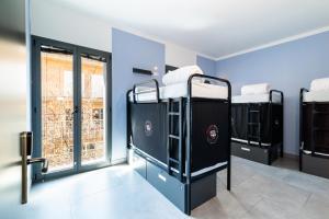 Postel nebo postele na pokoji v ubytování Hostel Carlota Braun
