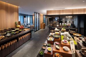 a buffet line with many different types of food at DoubleTree by Hilton Kyoto Station in Kyoto
