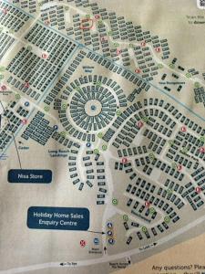 a map of a city with buildings and cars at Summer Breeze - Family Holiday home in Camber Sands in Camber +13 photos