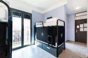 Postel nebo postele na pokoji v ubytování Hostel Carlota Braun