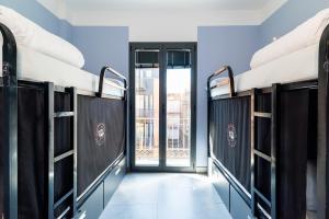 Postel nebo postele na pokoji v ubytování Hostel Carlota Braun