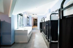 Postel nebo postele na pokoji v ubytování Hostel Carlota Braun