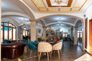 a living room with a couch and chairs at Mahdia - Baghdadi - Laourient Apartments, restaurant, café in Mahdia