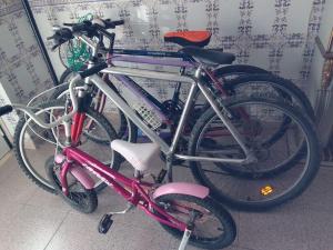 two bikes are parked next to each other at Azure Guest House in Silveira