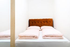 Posteľ alebo postele v izbe v ubytovaní Apartment Custozza