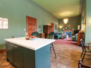 a kitchen and living room with a table and chairs at Derry - Mar Lodge Estate in Ballater +28 photos