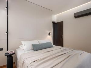 a bedroom with a large white bed in a room at ElKorin Jacuzzi Luxury Living in Chania