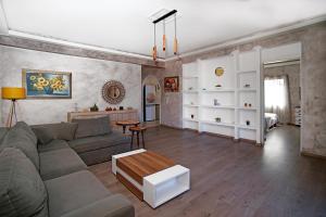 a living room with a couch and a table at Dimitra in Kyparissia