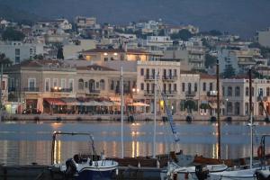 a group of boats docked in a harbor at night at Μεζονέτα AIKATERINI N 8 in Chios