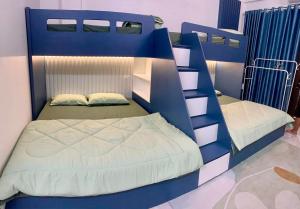 a bedroom with two bunk beds in a room at Homestay Cobalt House in Hai Phong