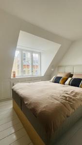 a bedroom with two beds in a attic at ApartmentInCopenhagen Apartment 1594 in Copenhagen