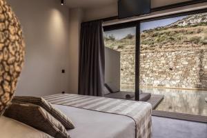 Postel nebo postele na pokoji v ubytování Doryssa Boutique Hotel
