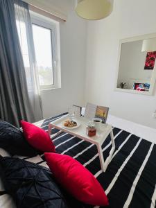 a living room with red pillows and a table at Gennadi Holiday Home in Gennadi