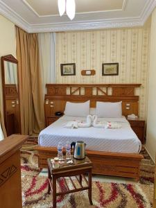 A bed or beds in a room at Teba Hotel Ras Elbar