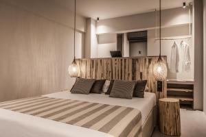 Postel nebo postele na pokoji v ubytování Doryssa Boutique Hotel