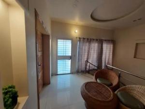 a living room with a couch and a balcony at 5 Bedrooms furnished separate upper portion house in DHA Phase 4, Lahore in Lahore