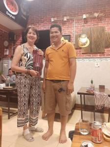 a man and a woman posing for a picture at STAY SWEET in Phnom Penh