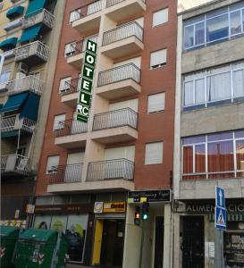 a building with a hotel sign on the side of it at Hotel RC Ramon y Cajal in Cuenca