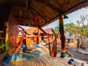a playground with a slide and a swing set at Samaki Guesthouse - Tad Lo in Ban Donkhagnoung