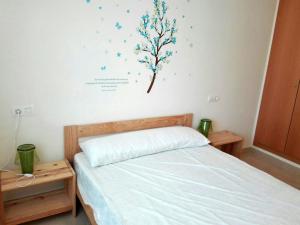 Postel nebo postele na pokoji v ubytování Apartamentos Los Almendros 3000