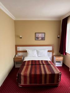 Postel nebo postele na pokoji v ubytování Minabir Otel