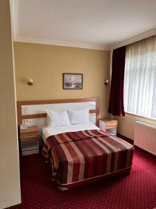 a hotel room with a bed in a room at Minabir Otel in Ankara +58 photos