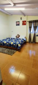 a bedroom with a bed in a room at BOB's Haven Bungalow in Ooty