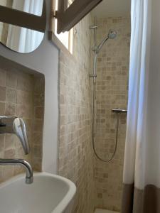 a bathroom with a shower and a sink at Le Mini - Un voyage en Provence in Aix-en-Provence