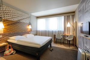 Postel nebo postele na pokoji v ubytování ibis Innsbruck