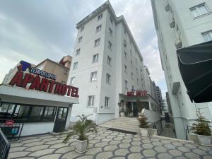 a white building with a sign on the side of it at Tempo Florya Otel in Istanbul