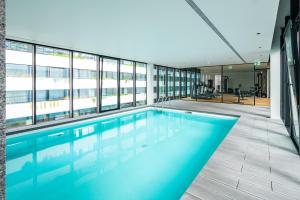 a swimming pool in the middle of a building at Mirabilis Apartments - LX Living in Lisbon