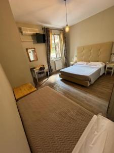 Postel nebo postele na pokoji v ubytování AgriHotel Villa Ambra