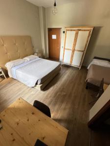 Postel nebo postele na pokoji v ubytování AgriHotel Villa Ambra