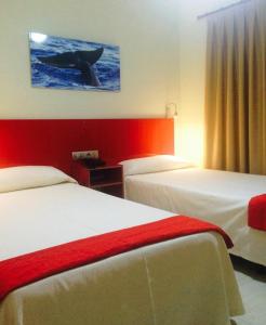 Postel nebo postele na pokoji v ubytování Hotel Andrea´s