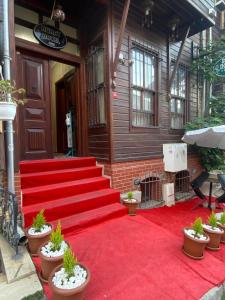 a red carpeted staircase in front of a building at Nuray Hotel in Istanbul