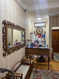 a dressing room with a mirror and a piano at Nuray Hotel in Istanbul