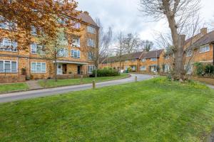 a row of brick houses on a street at Lovely 2BR in peaceful Hampstead, NW London in London