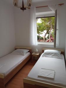 Postel nebo postele na pokoji v ubytování Guesthouse Dante