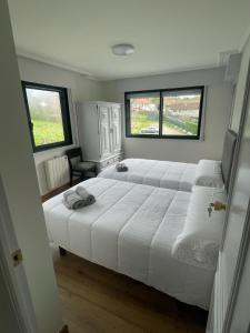 Un pat sau paturi într-o cameră la Posada Celtia