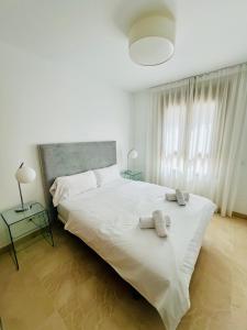 Posteľ alebo postele v izbe v ubytovaní Maison Élégante au Cœur du Golf de la Cala