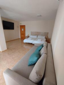 Postel nebo postele na pokoji v ubytování Hotel Algorfa