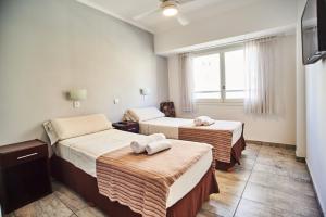Ένα ή περισσότερα κρεβάτια σε δωμάτιο στο Hotel Pelayo