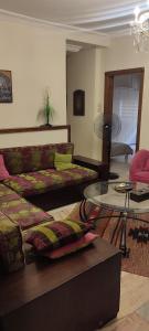 a living room with a couch and a table at apartments furnished for rent in Amman Jordan in Amman