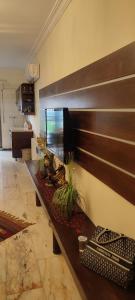 a living room with a bench with plants on it at apartments furnished for rent in Amman Jordan in Amman