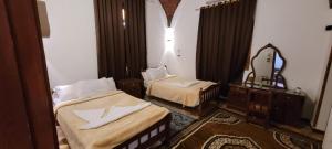 Postel nebo postele na pokoji v ubytování Luxor Villa Hatshepsut