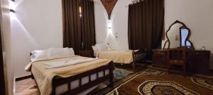 Postel nebo postele na pokoji v ubytování Luxor Villa Hatshepsut
